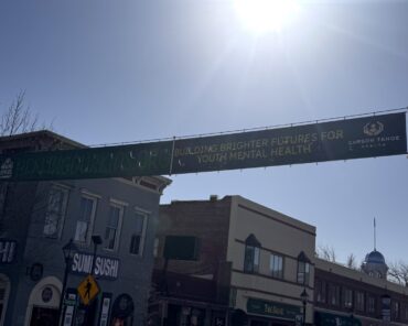 Healing Our Kids banner displayed along Carson Street promoting youth mental health support