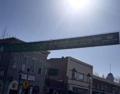 Healing Our Kids banner displayed along Carson Street promoting youth mental health support
