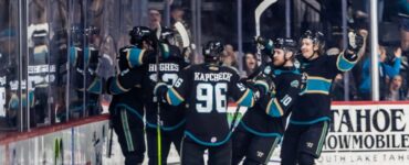 Tahoe Knight Monsters hockey players celebrating a goal on the ice during a game