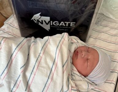 Newborn baby at Carson Tahoe Health with 529 college savings gift for families