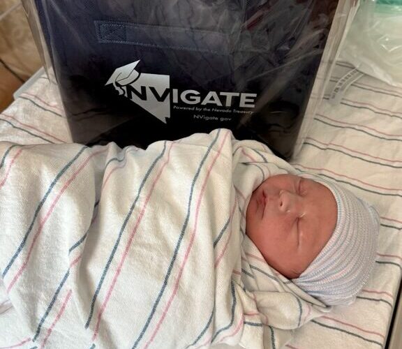 Newborn baby at Carson Tahoe Health with 529 college savings gift for families