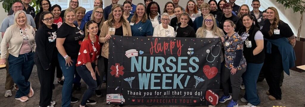 Carson Tahoe Health nurses celebrating National Nurses Week holding a thank-you banner
