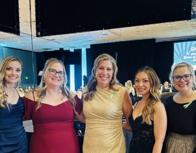 Carson Tahoe Health team members dressed in formal attire at the 2026 Nurses of Achievement Awards event, smiling together at a banquet venue.