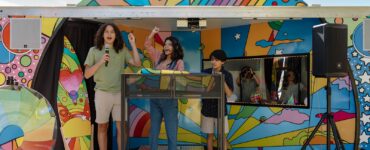 Children participating in a music and podcast activity inside the Sound Ideas outreach vehicle