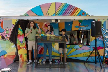 Children participating in a music and podcast activity inside the Sound Ideas outreach vehicle