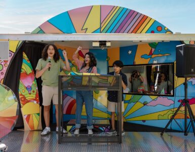 Children participating in a music and podcast activity inside the Sound Ideas outreach vehicle