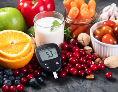 Healthy foods including fruits, vegetables, nuts, and milk with a glucose meter showing blood sugar levels, representing diabetes prevention and healthy lifestyle