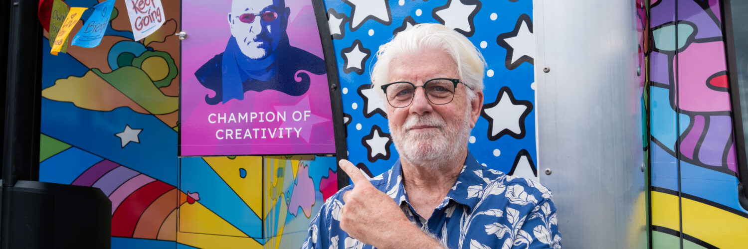 Michael McDonald of The Doobie Brothers points to a newly dedicated vinyl of Dave Mason on Carson Tahoe Health's SOUND IDEAS Vehicle of Change as their Champion of Creativity during the Dave Mason Legacy Dedication and Benefit Concert.