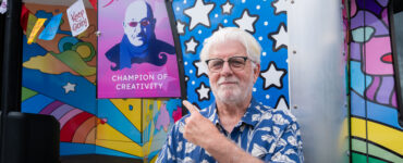 Michael McDonald of The Doobie Brothers points to a newly dedicated vinyl of Dave Mason on Carson Tahoe Health's SOUND IDEAS Vehicle of Change as their Champion of Creativity during the Dave Mason Legacy Dedication and Benefit Concert.